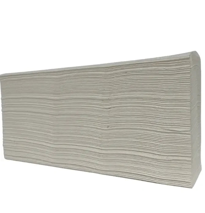 stack of white folded paper hand towels for cleaning or drying surfaces