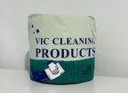 Toilet paper roll with hygienic packaging and cleaning symbols on a white background